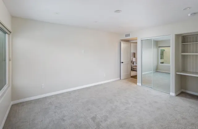 a aerial view of multi story residential apartment building with yard