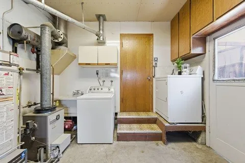 a view of hallway with washer and dryer