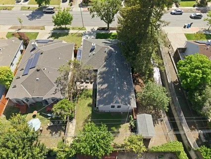 an aerial view of a house with a garden