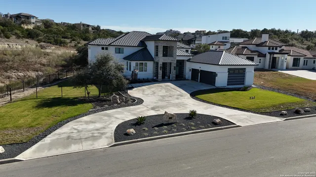a front view of a house with swimming pool and porch