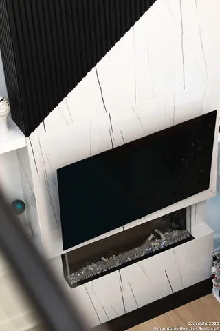 a view of walk in closet with clothes