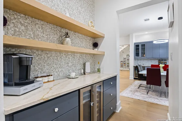 a bathroom with a sink a mirror and vanity
