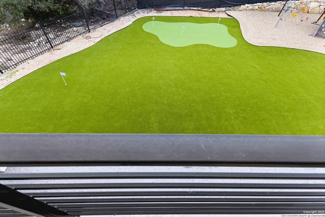 a living room with furniture and large windows