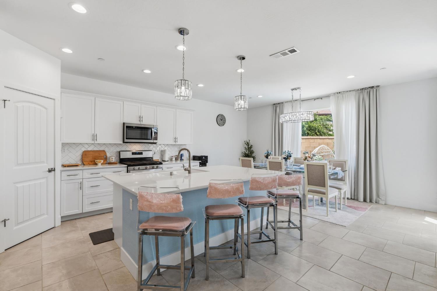 6326 West Richert Avenue Fresno, CA 93723 - Photo 7 of 45 a view of kitchen with dining table and chairs