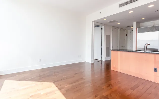 a view of a kitchen with a sink and a window