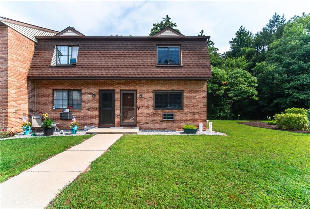 143 Pine Hill Road, Unit 13A Thomaston, CT 06787 - Photo 1 of 1 a front view of a house with a yard