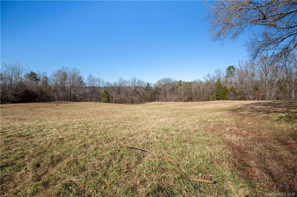 3780 Sawmill Road Hickory Grove, SC 29717 - Photo 11 of 35 a view of a field with trees in the background