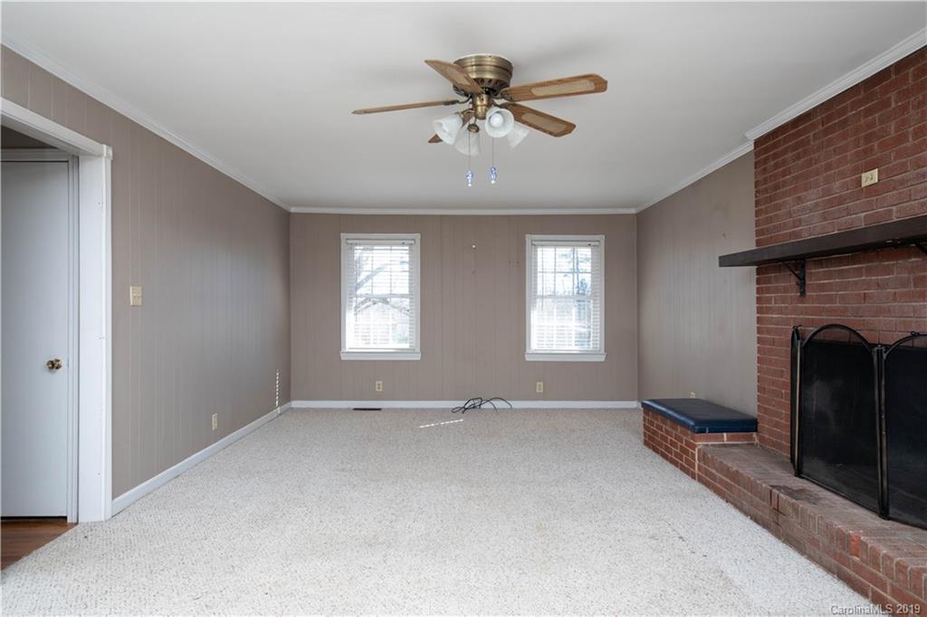 3780 Sawmill Road Hickory Grove, SC 29717 - Photo 18 of 35 a view of an empty room with a fireplace and a window