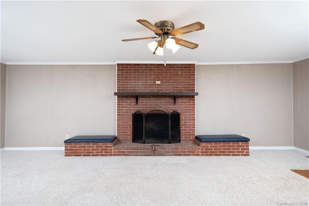3780 Sawmill Road Hickory Grove, SC 29717 - Photo 19 of 35 a living room with furniture and a fireplace