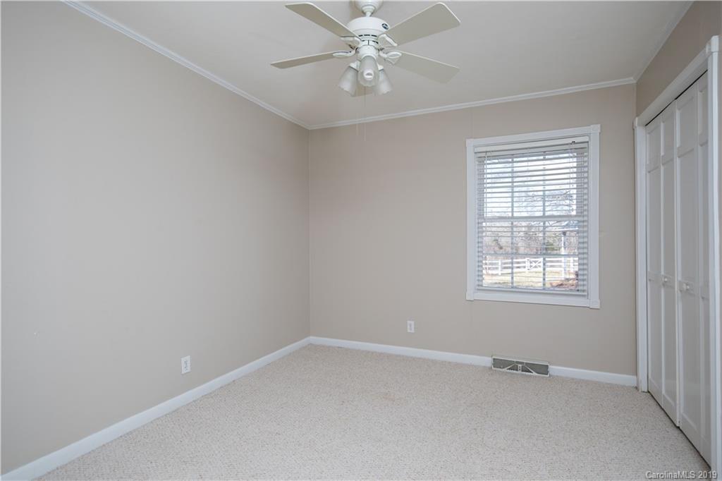 3780 Sawmill Road Hickory Grove, SC 29717 - Photo 20 of 35 an empty room with a window and a fan