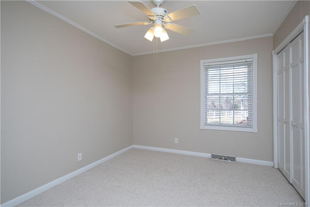 3780 Sawmill Road Hickory Grove, SC 29717 - Photo 21 of 35 an empty room with a window and a fan