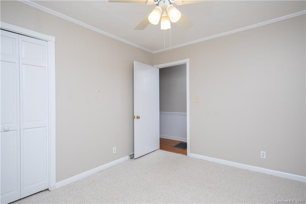 3780 Sawmill Road Hickory Grove, SC 29717 - Photo 22 of 35 an empty room with a chandelier fan and closet area