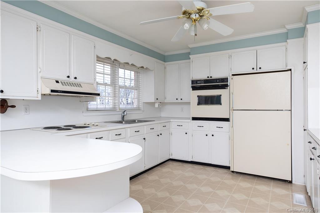 3780 Sawmill Road Hickory Grove, SC 29717 - Photo 26 of 35 a kitchen with cabinets appliances a sink and a window