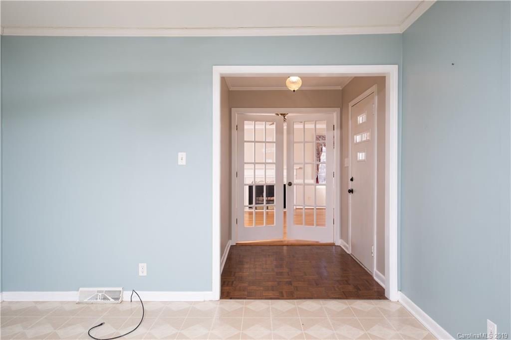 3780 Sawmill Road Hickory Grove, SC 29717 - Photo 30 of 35 a view of a hallway with wooden floor and a bathroom