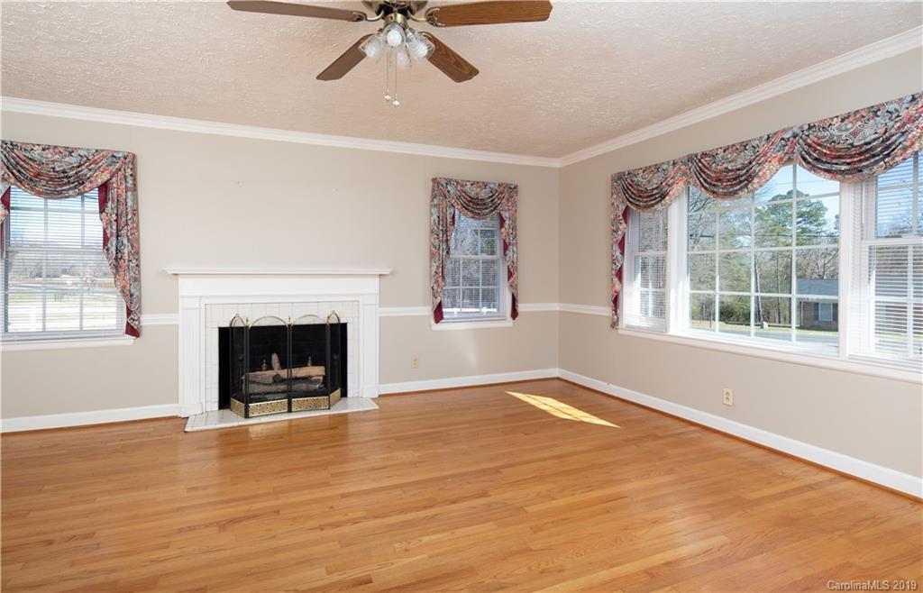 3780 Sawmill Road Hickory Grove, SC 29717 - Photo 31 of 35 a view of an empty room with a window and fireplace