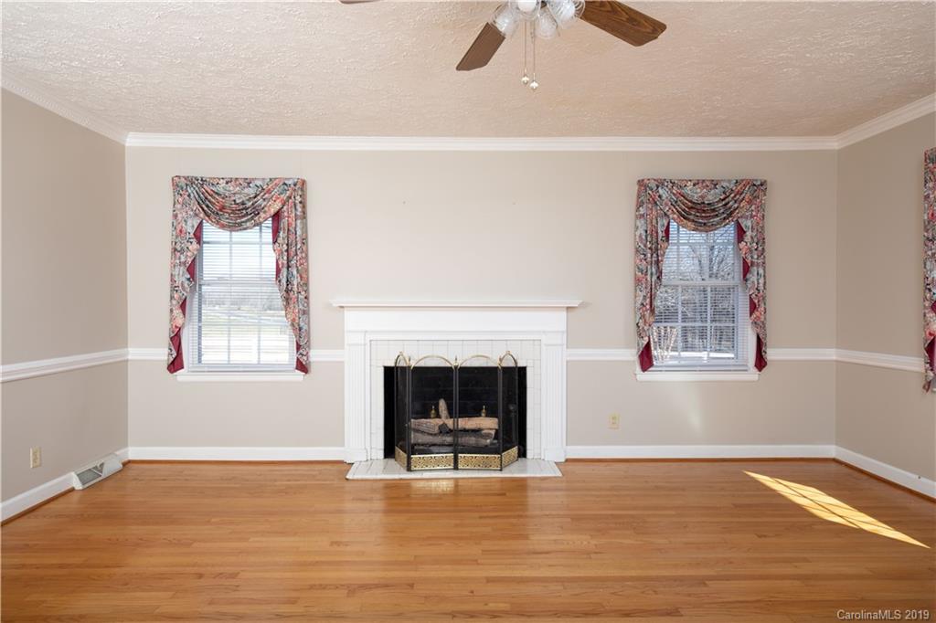 3780 Sawmill Road Hickory Grove, SC 29717 - Photo 32 of 35 a living room with furniture and a fireplace