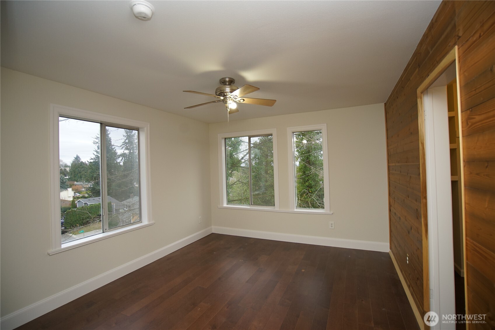 2811 Southwest 350th Place Federal Way, WA 98023 - Photo 11 of 23 a view of an empty room with a window and wooden floor