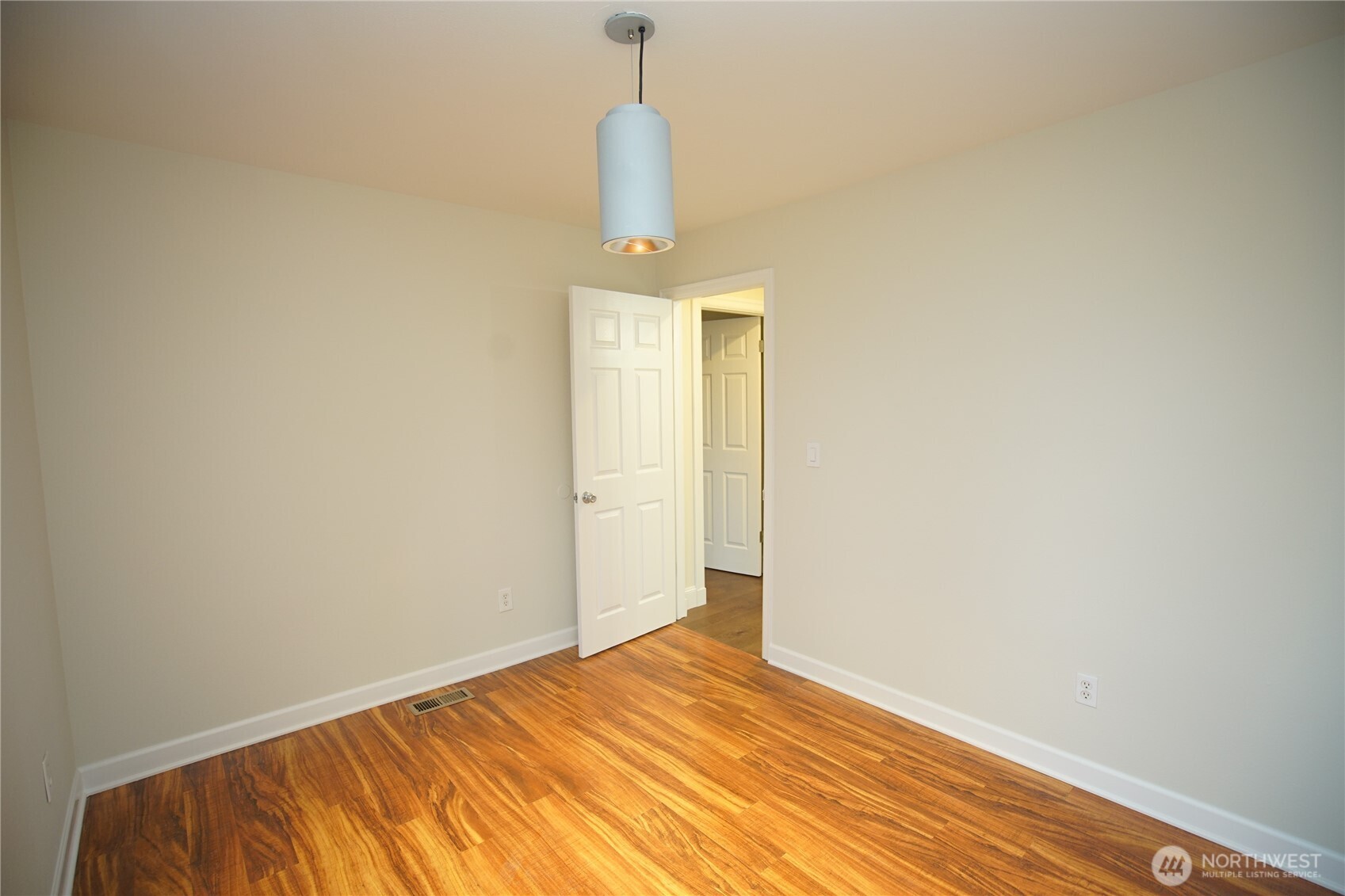 2811 Southwest 350th Place Federal Way, WA 98023 - Photo 17 of 23 a view of an empty room with wooden floor and a window