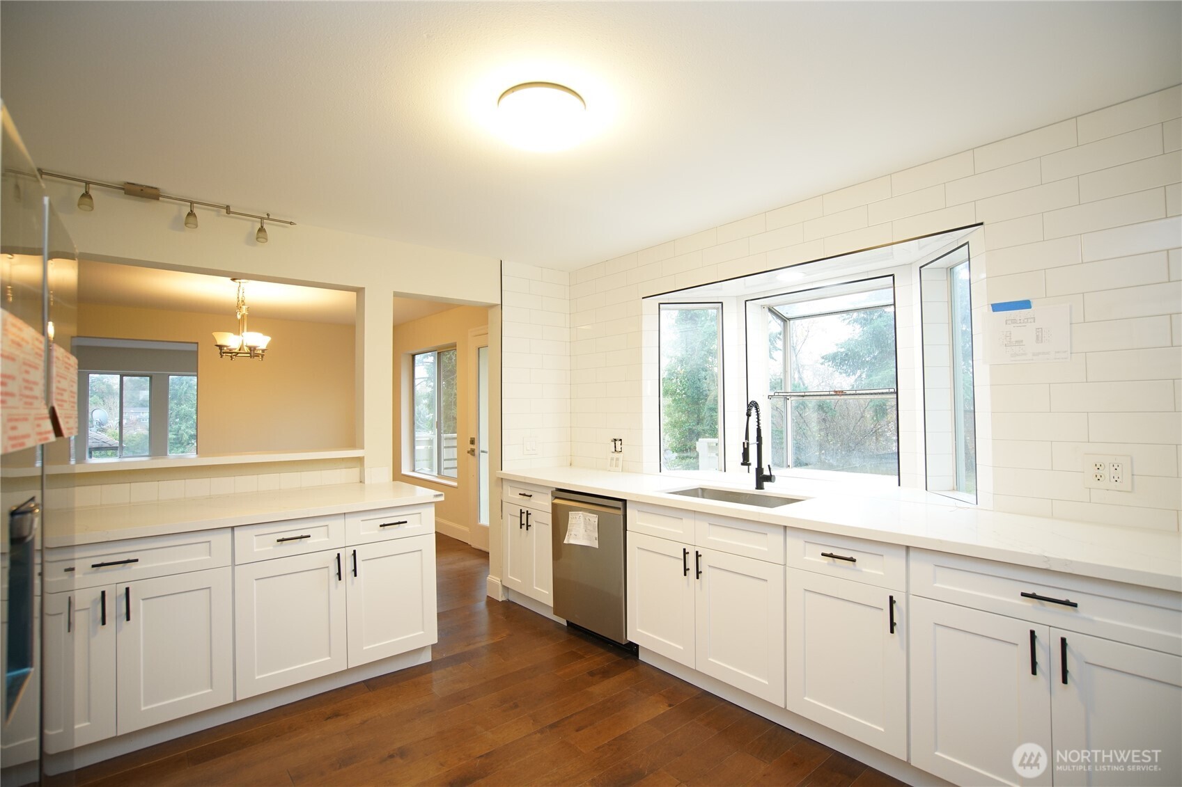 2811 Southwest 350th Place Federal Way, WA 98023 - Photo 4 of 23 a kitchen with white cabinets and sink