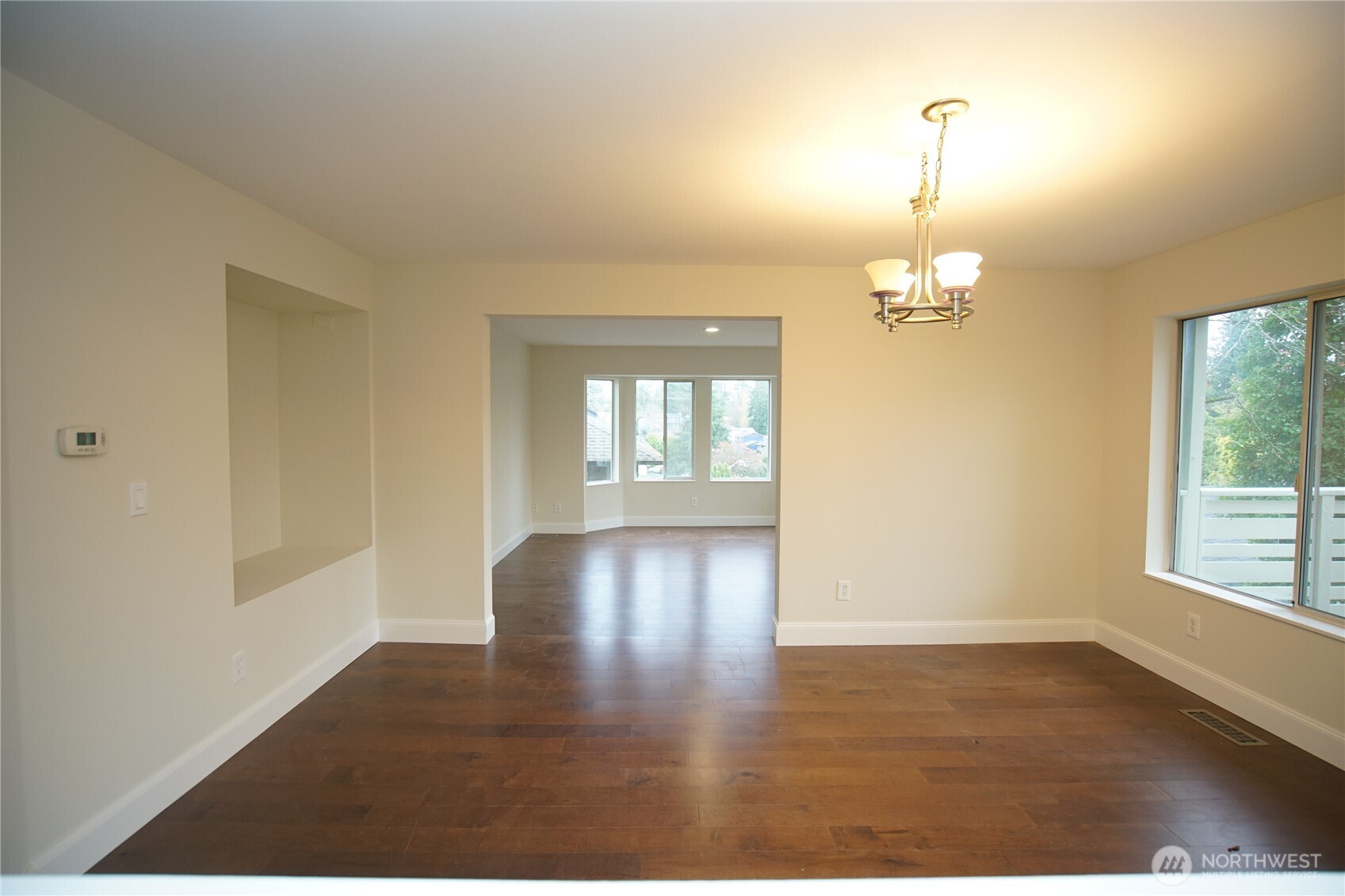 2811 Southwest 350th Place Federal Way, WA 98023 - Photo 6 of 23 an empty room with wooden floor and chandelier
