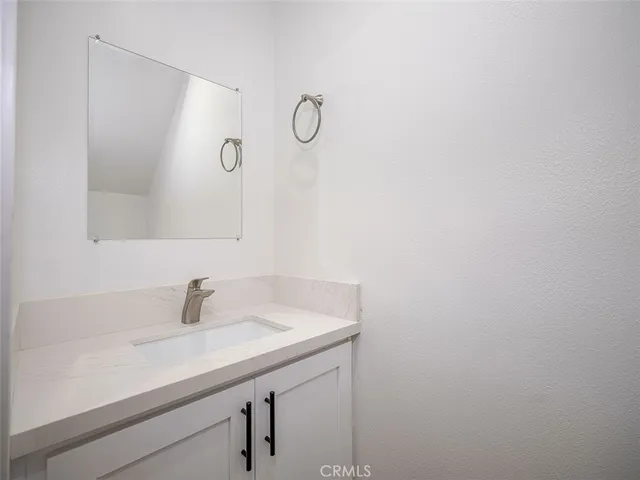 a bathroom with a sink and mirror