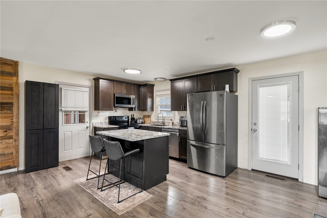 4508 Old Williamston Road Belton, SC 29627 - Photo 9 of 47 This modern kitchen features a spacious island, sleek stainless steel appliances, and ample cabinetry.