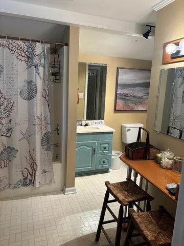 a dining room with a table and chairs