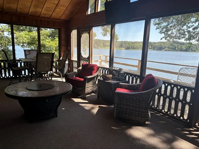 a view of a dining room with furniture window and outside view