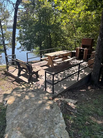 a view of a backyard with sitting area