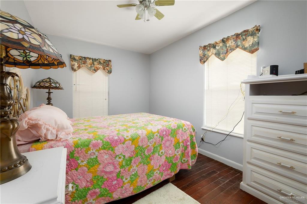218 East Sam Houston Boulevard Pharr, TX 78577 - Photo 12 of 25 a bedroom with a bed and a dresser in it