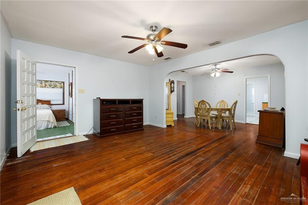 218 East Sam Houston Boulevard Pharr, TX 78577 - Photo 4 of 25 a living room with furniture and a wooden floor