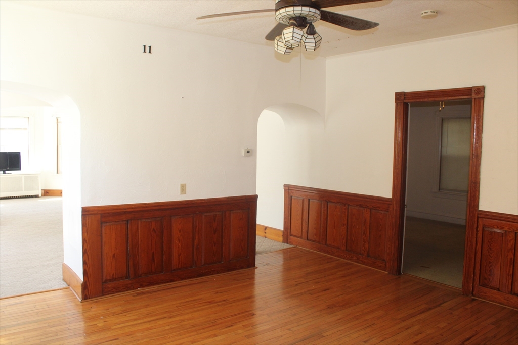 136 Horton Street, Unit 1 Fall River, MA 02723 - Photo 2 of 17 a view of a room with wooden floor
