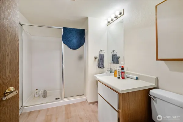 a bathroom with a sink vanity and a mirror