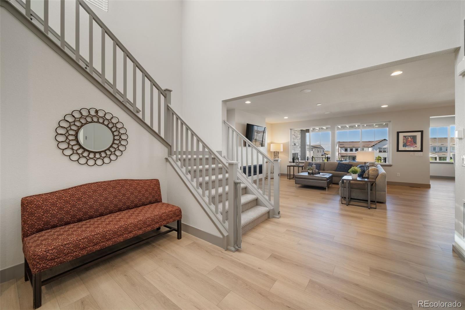 6465 Barnstead Drive Castle Pines, CO 80108 - Photo 16 of 50 a living room with furniture and stairs