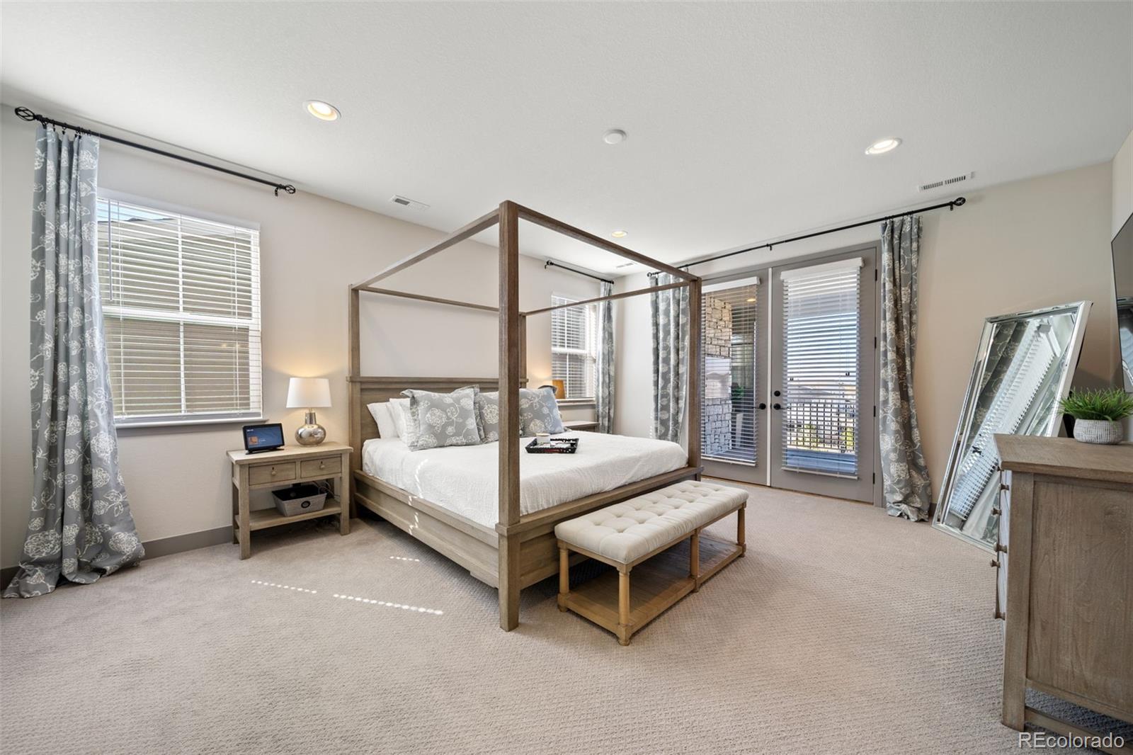 6465 Barnstead Drive Castle Pines, CO 80108 - Photo 17 of 50 a white bed sitting in a room next to a window