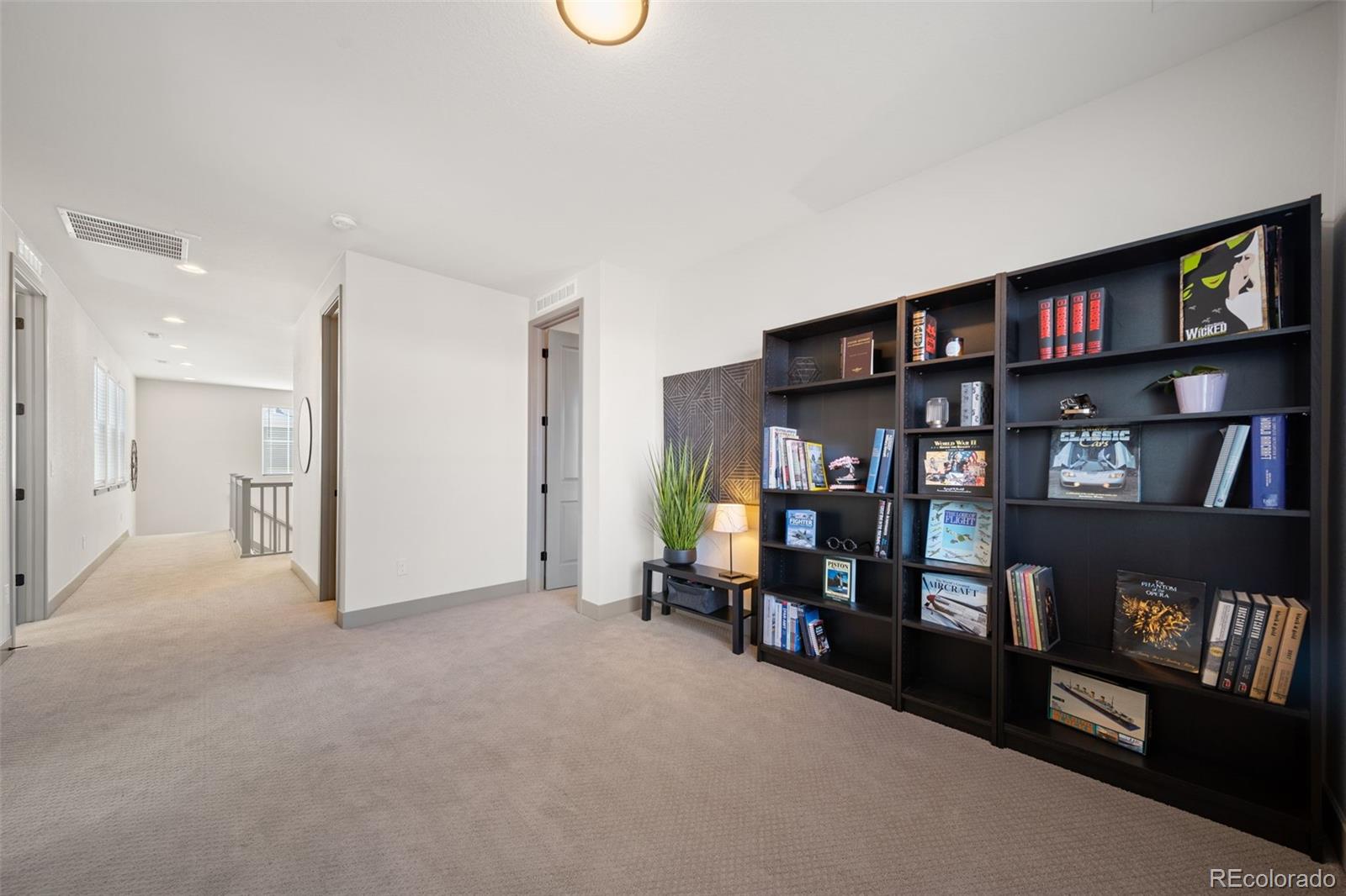 6465 Barnstead Drive Castle Pines, CO 80108 - Photo 24 of 50 a view of a livingroom with furniture and cabinet