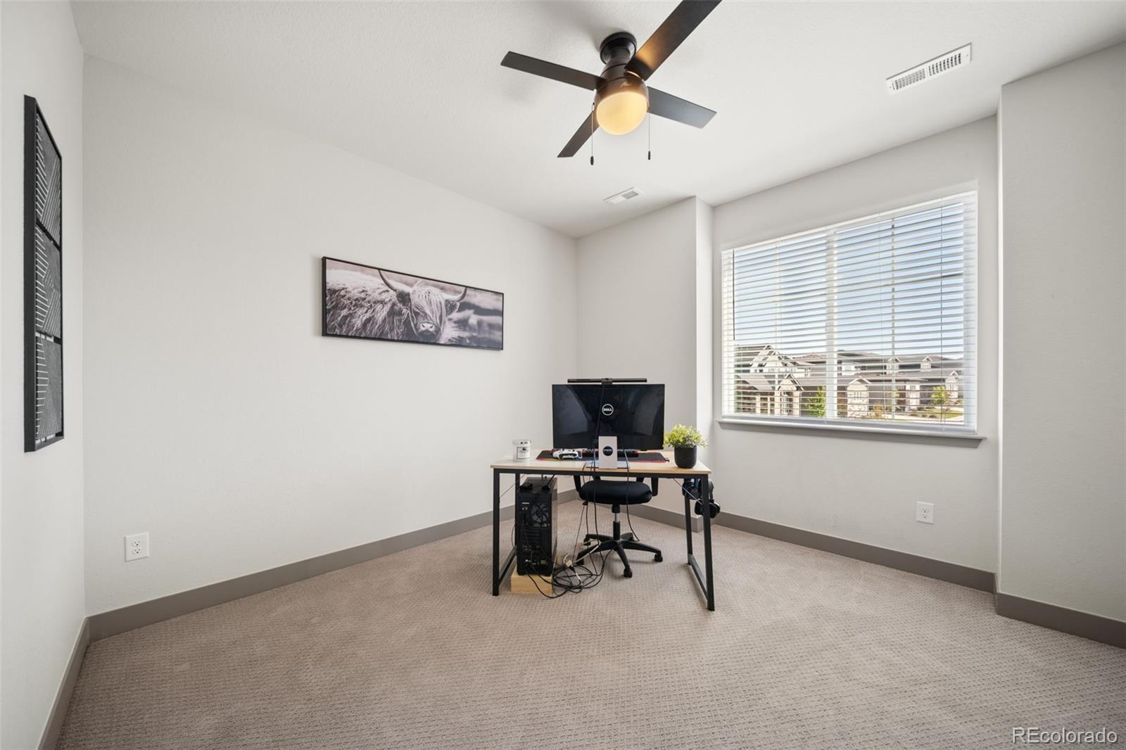 6465 Barnstead Drive Castle Pines, CO 80108 - Photo 25 of 50 a view of a workspace with furniture and a window
