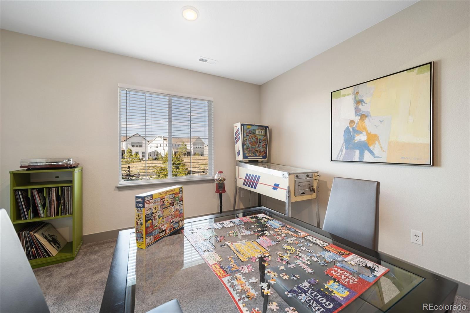 6465 Barnstead Drive Castle Pines, CO 80108 - Photo 38 of 50 a living room with furniture and a flat screen tv