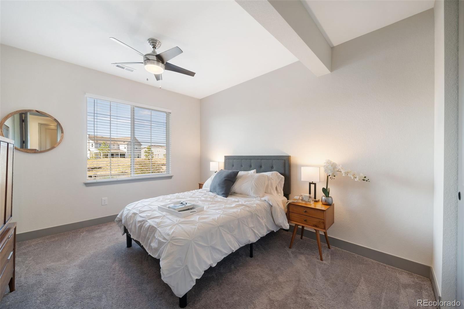 6465 Barnstead Drive Castle Pines, CO 80108 - Photo 43 of 50 a bedroom with a bed and window