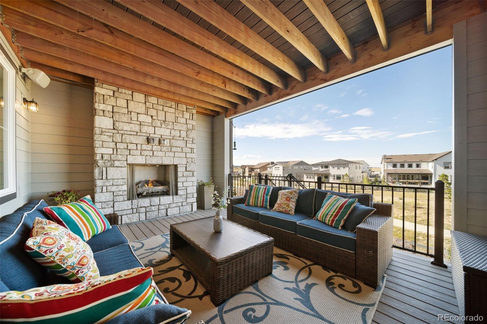6465 Barnstead Drive Castle Pines, CO 80108 - Photo 45 of 50 a outdoor living space with furniture and a fireplace