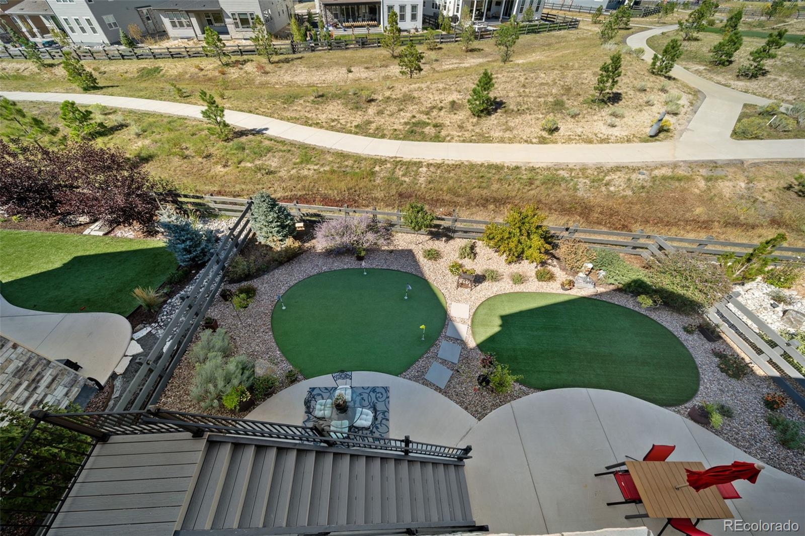 6465 Barnstead Drive Castle Pines, CO 80108 - Photo 48 of 50 a view of a house with a yard