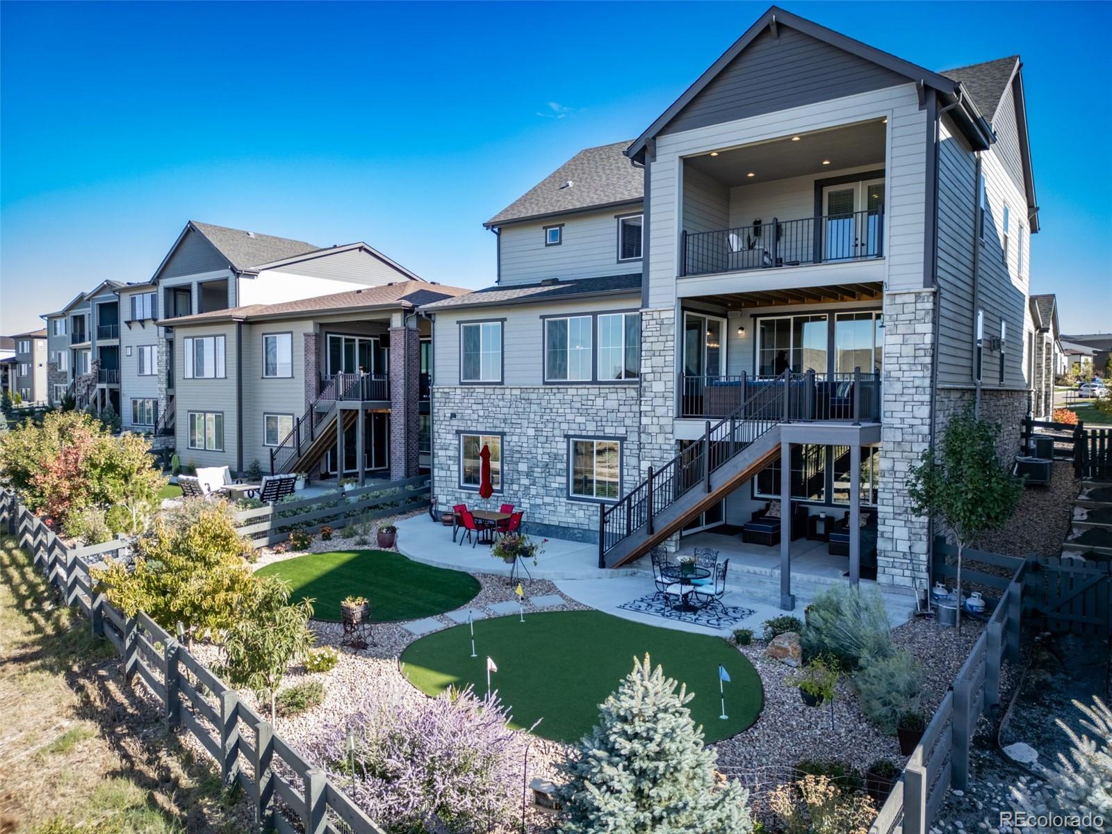 6465 Barnstead Drive Castle Pines, CO 80108 - Photo 50 of 50 a view of a house with a yard patio and sitting area