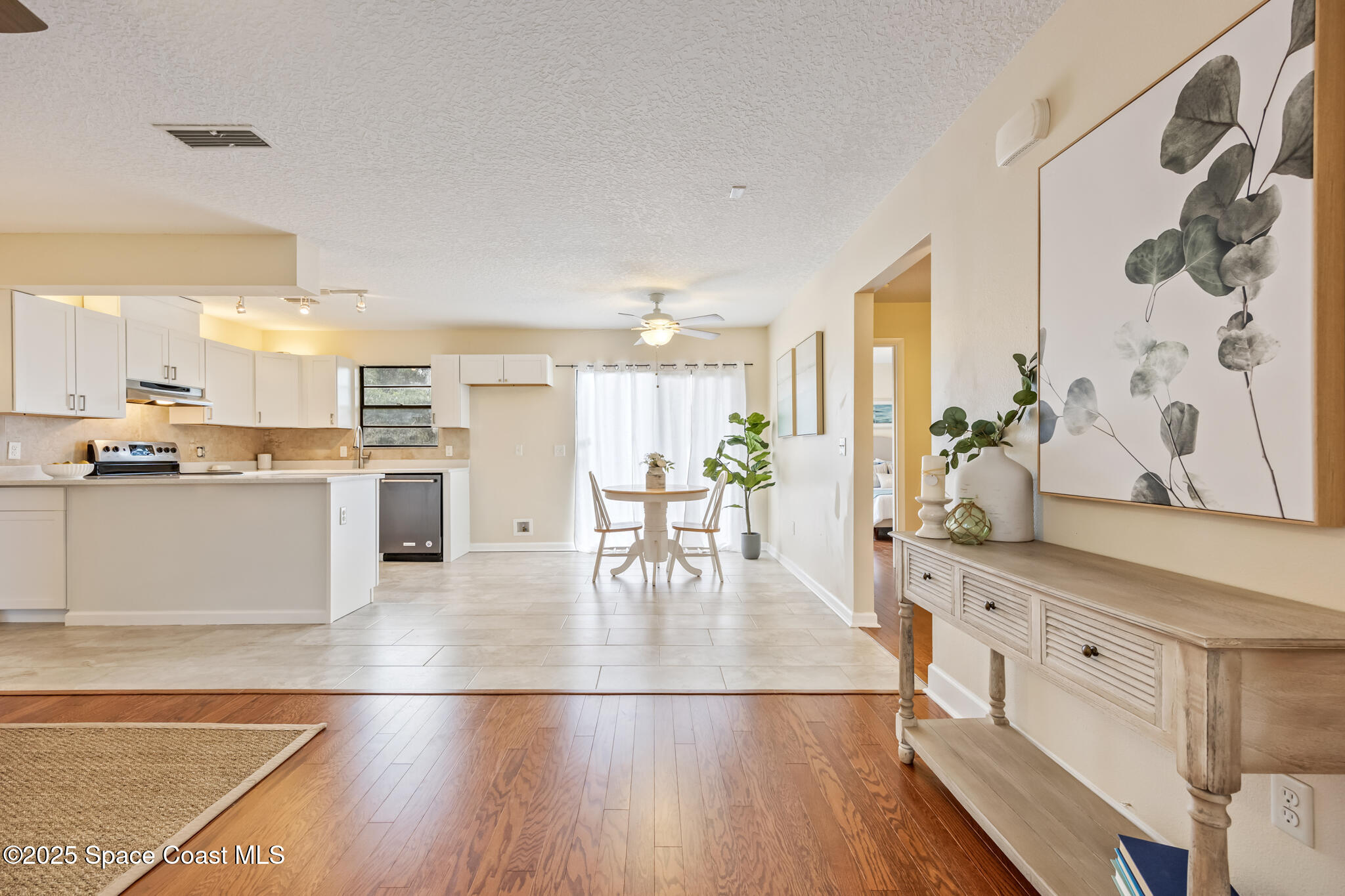 286 Alegriano Road Northwest Palm Bay, FL 32907 - Photo 11 of 24 a view of kitchen with stainless steel appliances kitchen island wooden floors and center island