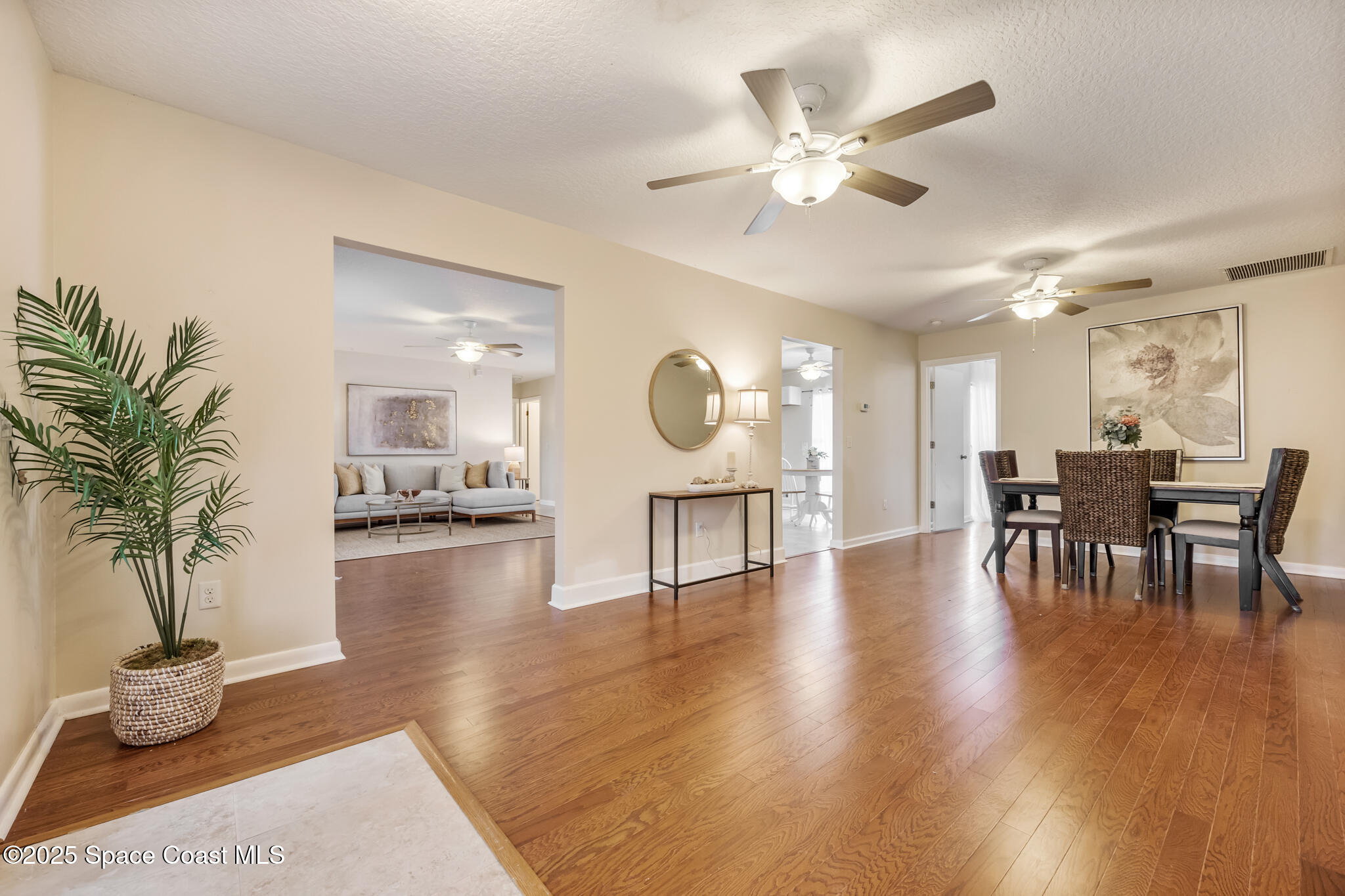 286 Alegriano Road Northwest Palm Bay, FL 32907 - Photo 4 of 24 a living room with furniture and a wooden floor