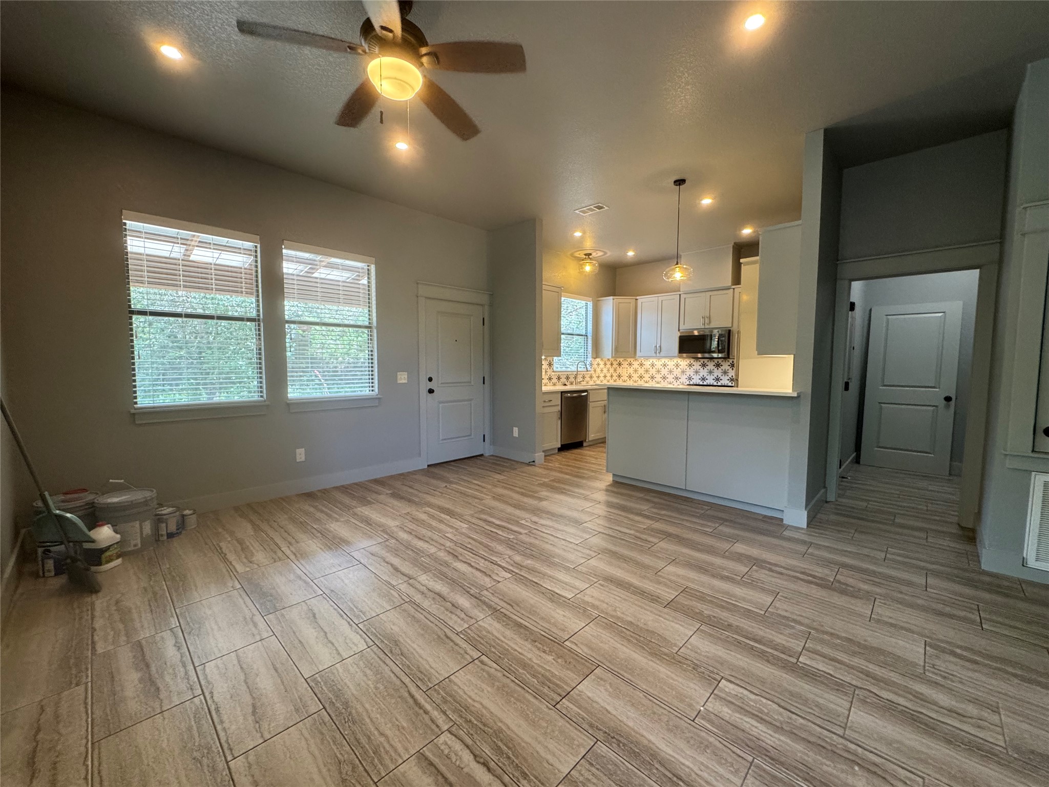 290 Hugo Road, Unit B San Marcos, TX 78666 - Photo 5 of 22 a view of an empty room with window and wooden floor