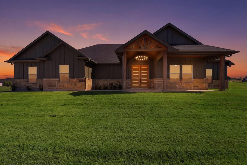 6657 Buffalo Ridge Circle Godley, TX 76044 - Photo 1 of 31 a front view of a house with garden
