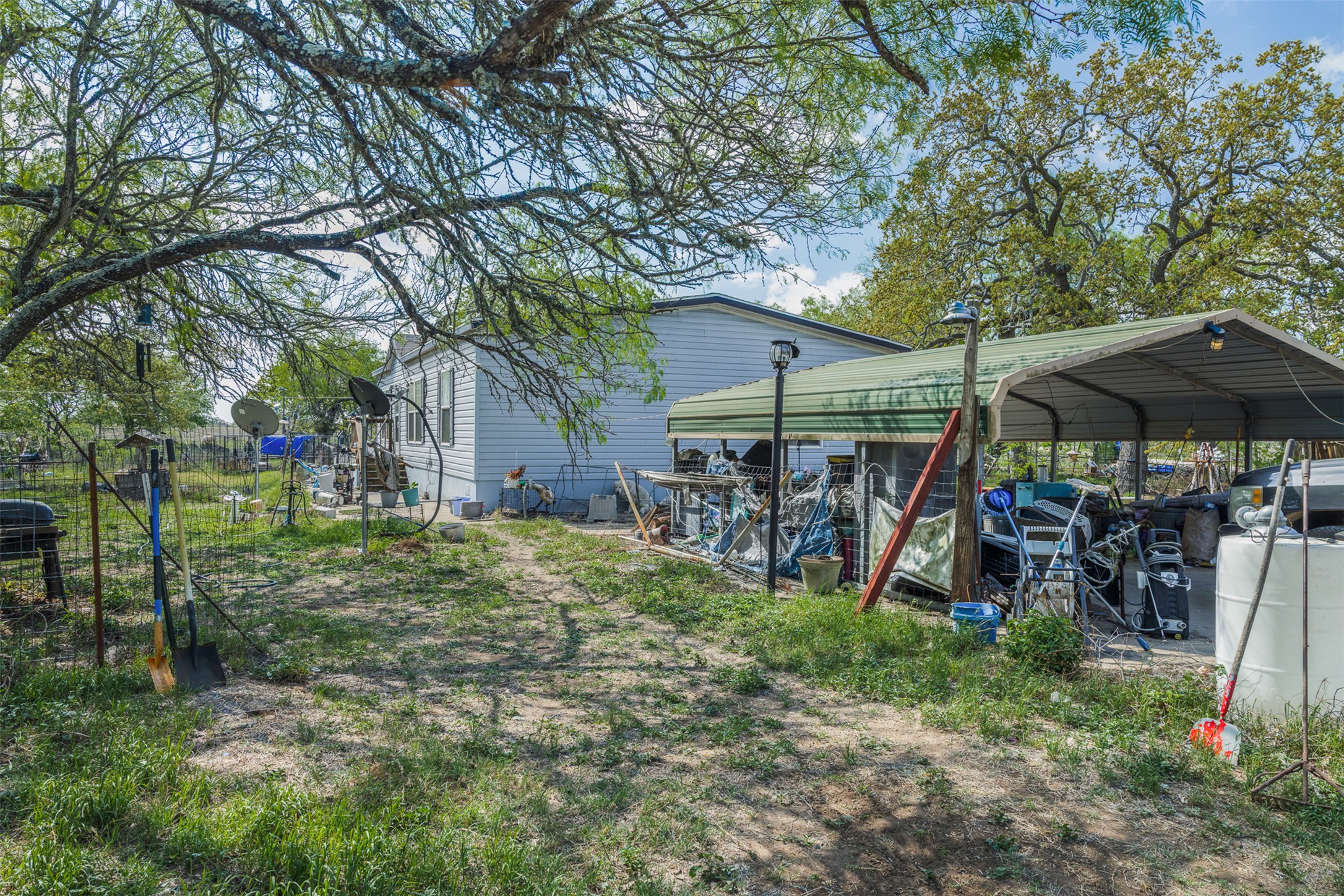 8519 State Park Road Lockhart, TX 78644 - Photo 15 of 40 View of yard featuring a detached carport