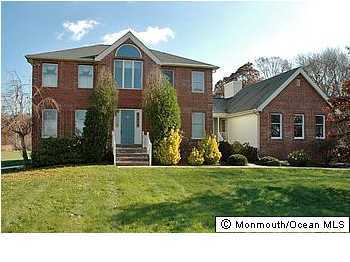 26 Spring Road Millstone Township, NJ 08510 - Photo 1 of 3 a front view of a house with a yard
