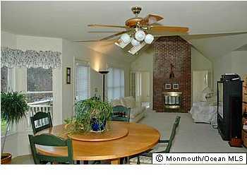 26 Spring Road Millstone Township, NJ 08510 - Photo 3 of 3 a view of a living room and kitchen