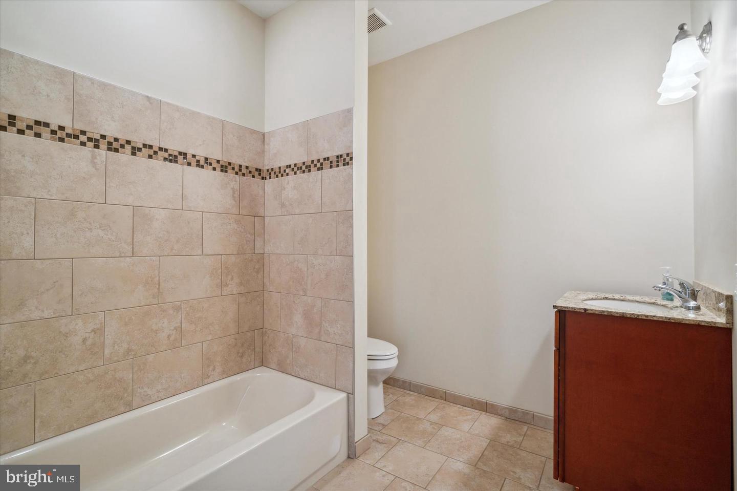 118 Richmond Street, Unit 2B Philadelphia, PA 19125 - Photo 6 of 14 a bathroom with a bathtub and shower